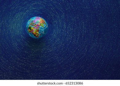 Globe top view. Empty space for text. Simulation of the galaxy, starry sky.