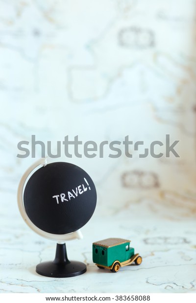 Globe with travel word on it plus car, travel the\
world concept