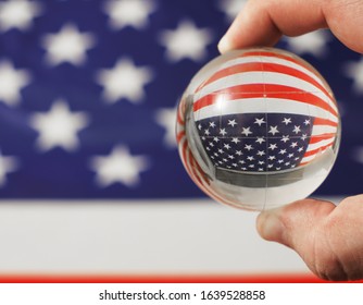 Globe and USA Flag for background. United states flag with crystal glass globe on wood background, 4th of July concept. Independence Day - Shutterstock ID 1639528858