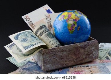 Globe With World Currencies In Marble Box And Placed On World Currency