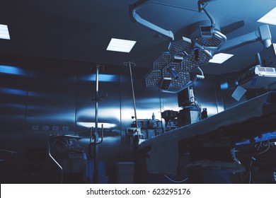 Gloomy colors of a night operating room ready to receive a patient
