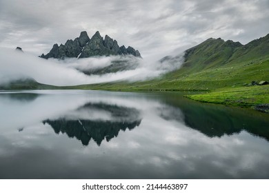 Gloomy rainy day at Tobavarchkhili lake in Caucasus mountains, Georgia. - Powered by Shutterstock