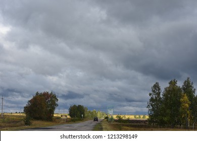 Gloomy Sky And Yellow Field In Autumn