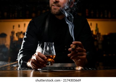 Glorious View Of Male Hands Holding A Glass Of Strong Alcoholic Drink And Smoking Cuban Cigar