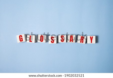 Glossary word made of square letter word on blue background.