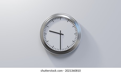 Glossy chrome clock on a white wall at half past nine. Time is 09:30 or 21:30