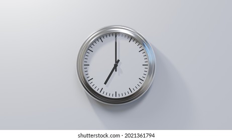 Glossy chrome clock on a white wall at seven o'clock. Time is 07:00 or 19:00