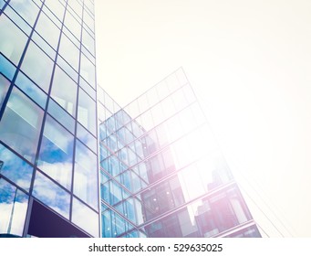 Glossy Facade Of An Office Building With Sun Coming Through The Glass.