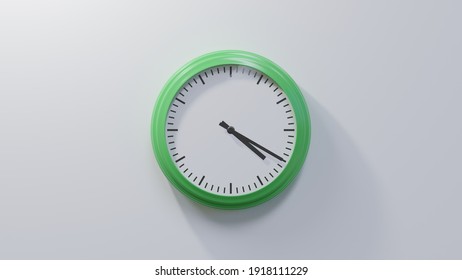 Glossy green clock on a white wall at twenty past four. Time is 04:20 or 16:20 - Shutterstock ID 1918111229