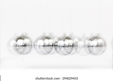 Glossy Momentum Balls Blur In Stop Motion On White Background