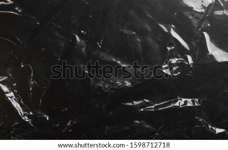glossy polyethylene on a dark background