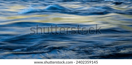 Glossy Surface of Fast Moving Waters in Merced River in Yosemite