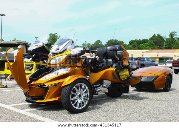 GLOUCESTER, VA - JULY 9, 2016: A gold Can Am Spyder
reversed three wheeled motorcycle at the Collector Car Appreciation
Day Car Show sponsored by the Middle Peninsula Classic Cruisers car
club.