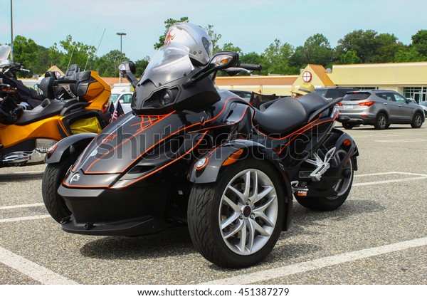 GLOUCESTER,\
VA - JULY 9, 2016: A Black Can Am reversed three wheeled motorcycle\
at the Collector Car Appreciation Day Car Show sponsored by the\
Middle Peninsula Classic Cruisers car\
club.