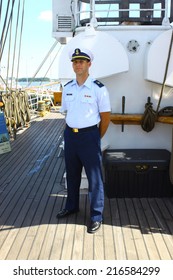 GLOUCESTER, VA - SEPTEMBER 6, 2014: An Eagle Officer  Greeting The Public On The USCGC Eagle Barque At The Yorktown Coast Guard Training Center Pier Where It Is Tied Up On The York River In Virginia