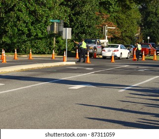 GLOUCESTER, VA, USA - OCTOBER 22: A Deputy Setup To Direct Traffic For The Gloucester High School Homecoming Parade Coming Down Main Street. On October 22, 2011 In Gloucester, VA, USA