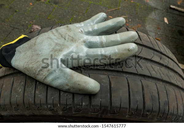 Glove for changing tires\
on a car tyre