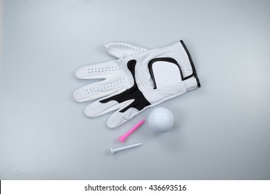 Glove, Golf Ball And Tees Isolated On White