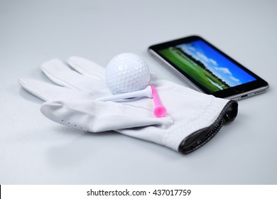 Glove, Golf Ball, Tees And Smartphone Isolated On White