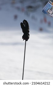 glove stuck in the ski pole in the ski slope