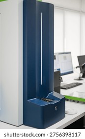 Gloved Hand Loading Sample Into Analyzer. Clinical Benchtop Instrument Receiving Cartridge For Diagnostic