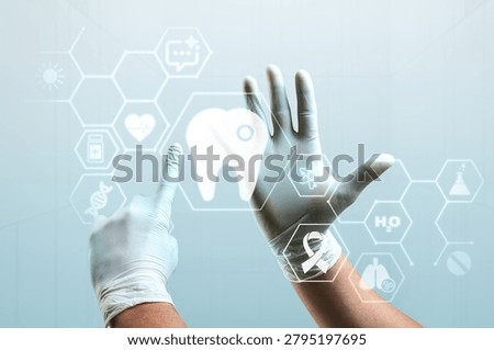 Gloved hands interacting with a digital tooth icon and medical symbols