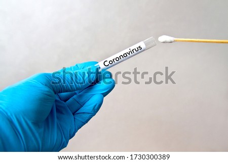 Gloved hands with swab, patient sample collection, sterile sample ready for analysis, viral disease testing COVID-19 pandemic, coronavirus [[stock_photo]] © 