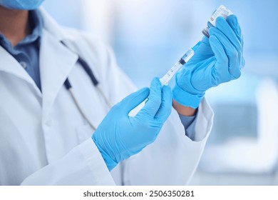 Gloves, test and doctor with medicine, syringe or preparing of vaccine, prevention or healthcare. Hospital, hands and injection for protection of flu, virus and person with dose, science and solution - Powered by Shutterstock