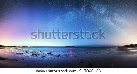 The glow from the Northern Lights and the Milky WAy over Coquet Lighthouse in Northumbria