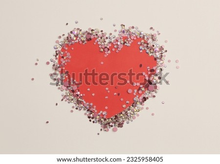 Glow sparkle rhinestones glitter heart paper frame blank. Abstract copy space texture beige background.