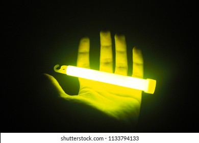 Glow Stick On Hand In The Darkroom