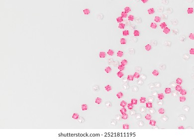 Glowing acrylic beads scattered on a blue background with place for text. - Powered by Shutterstock