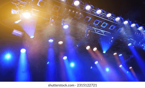 glowing blue ceiling spotlights working during the show - Shutterstock ID 2315122721