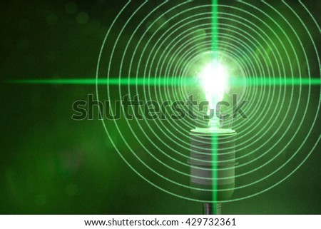 Glowing bulb is emitting circular datastreams of one and zero Lifi concept