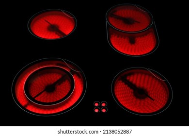 Glowing burner of the electric hotplate on black background. Electric hob close up. Selective focus