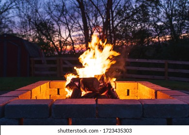 Glowing Campfire In Backyard Fire Pit
