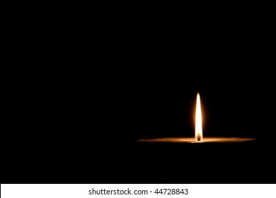 Glowing Candle On The Dark