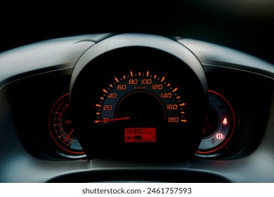 Glowing car dashboard, showcasing illuminated controls and unique design elements, enhancing the driving experience with a sleek and simple look