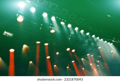 glowing ceiling green spotlights working during the musical concert, lights the stage - Shutterstock ID 2321870043
