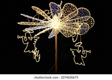 Glowing Christmas angels playing the pipe. Selective focus. High quality photo - Shutterstock ID 2074030673