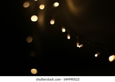 Glowing Christmas Lights On Black Background