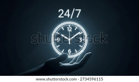 Glowing clock in hand with 24 7 text