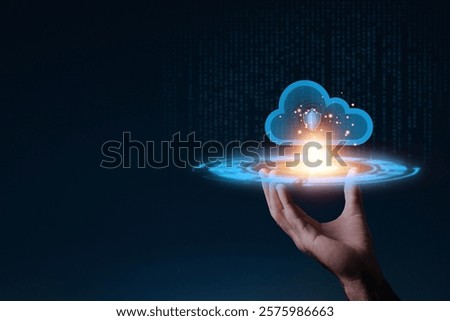 A glowing cloud with a shield symbol floating above a hand, representing cloud computing and data security in technology.
