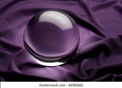 Glowing Crystal Ball Shot On Purple Satin