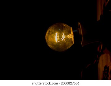 Glowing Electric Blub In Night