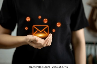 A glowing email icon surrounded by add highlighting communication and connectivity. - Powered by Shutterstock