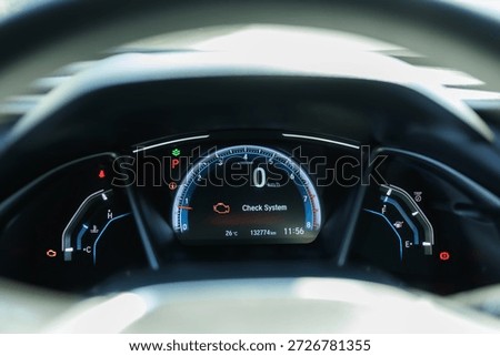 Glowing engine light in the dark. Symbolizing urgent car diagnostics and care.