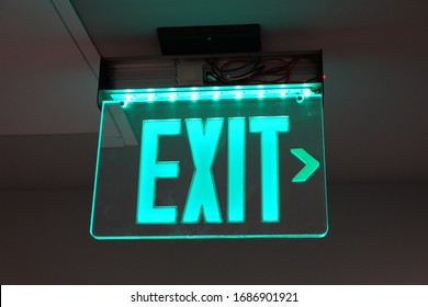 Glowing Green Exit Sign, Evacuation Sign, Safety Sign, Office Building Sign.