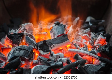 Glowing Hot Charcoal In BBQ Stove burning Grill Flames Background Texture. - Powered by Shutterstock