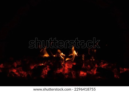 Glowing hot coals. Oven with burning fire. Close-up, Background. The texture of fire.